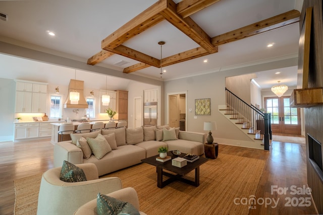 724 Ideal Way, Charlotte, NC 28203 - living area with light wood-style flooring, beam ceiling, stairs, recessed lighting, and a chandelier