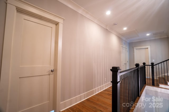 724 Ideal Way, Charlotte, NC 28203 - hall featuring wood finished floors, an upstairs landing, recessed lighting, attic access, and crown molding