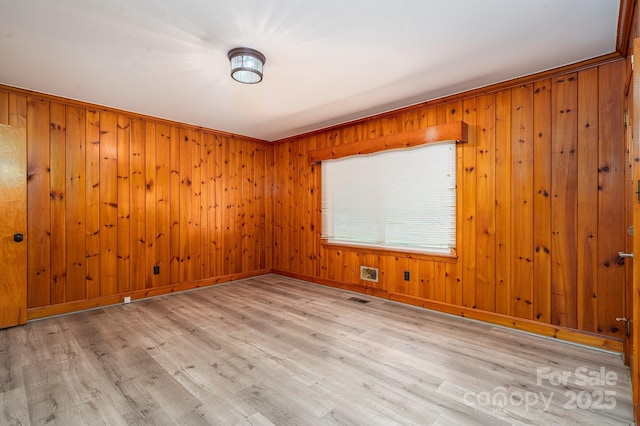 3340 Wrenwood Dr, Newton, NC 28658 - unfurnished room with light wood finished floors, wooden walls, and baseboards
