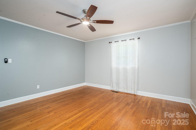 3340 Wrenwood Dr, Newton, NC 28658 - empty room featuring visible vents, a ceiling fan, ornamental molding, baseboards, and light wood-style flooring