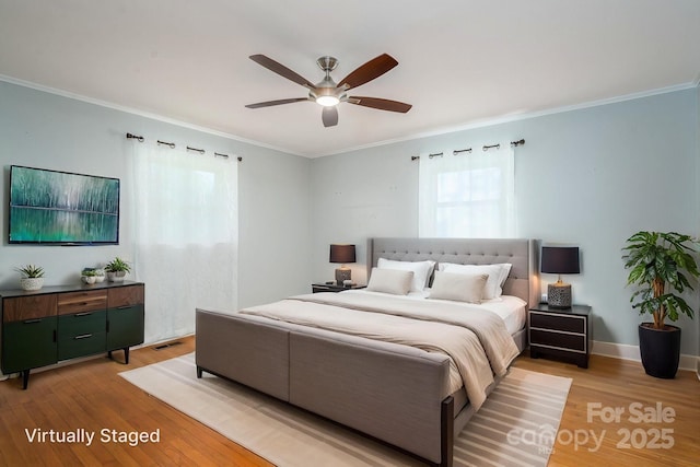 3340 Wrenwood Dr, Newton, NC 28658 - bedroom with a ceiling fan, crown molding, and light wood-type flooring