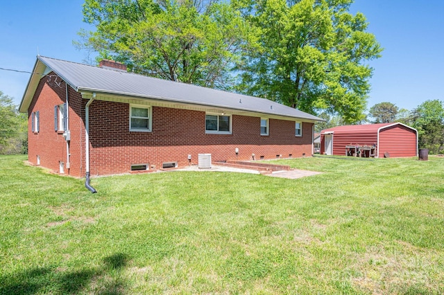 3340 Wrenwood Dr, Newton, NC 28658 - back of property featuring a chimney, central AC unit, brick siding, and a yard