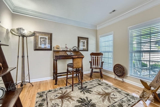 1151 Donelea Ln NW, Concord, NC 28027 - living area with wood finished floors, visible vents, crown molding, and baseboards