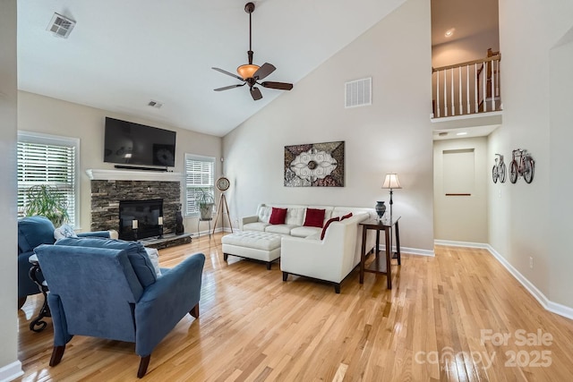 1151 Donelea Ln NW, Concord, NC 28027 - living room featuring a healthy amount of sunlight, baseboards, visible vents, a ceiling fan, and high vaulted ceiling