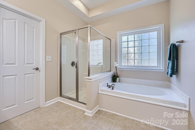 1151 Donelea Ln NW, Concord, NC 28027 - bathroom with a bath, baseboards, and a shower stall