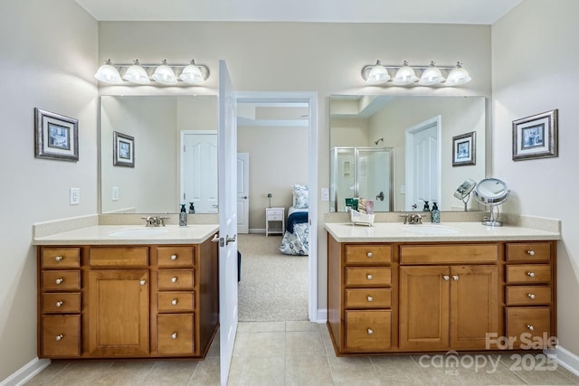 1151 Donelea Ln NW, Concord, NC 28027 - full bathroom featuring a shower stall, two vanities, and a sink