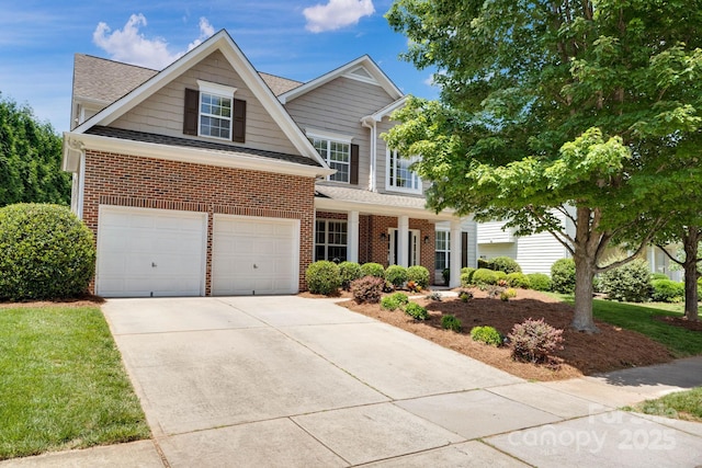 view of front of property with concrete driveway, an attached garage, brick siding, and roof with shingles