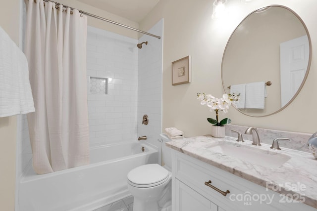 bathroom with shower / tub combo with curtain, toilet, and vanity