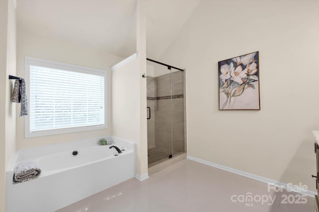 full bath featuring a shower stall, a garden tub, tile patterned floors, and baseboards