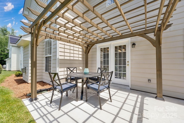 view of patio / terrace with a pergola, cooling unit, and outdoor dining space