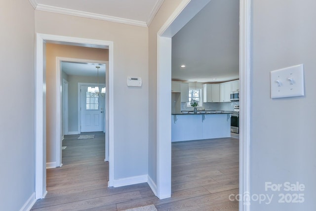 3424 Walker Cir, Lenoir, NC 28645 - corridor featuring an inviting chandelier, light wood-type flooring, baseboards, ornamental molding, and recessed lighting