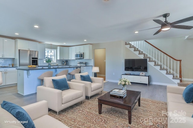 3424 Walker Cir, Lenoir, NC 28645 - living room featuring a ceiling fan, stairs, recessed lighting, and wood finished floors