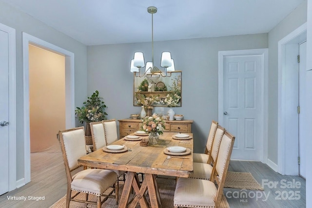 3424 Walker Cir, Lenoir, NC 28645 - dining space with a chandelier, light wood-style flooring, and baseboards