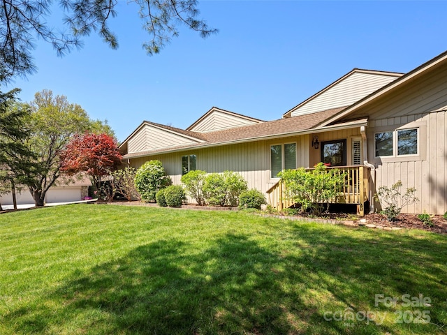 view of side of home featuring a lawn