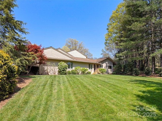 view of property exterior with a yard