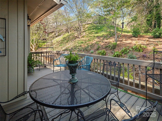 wooden deck with outdoor dining area