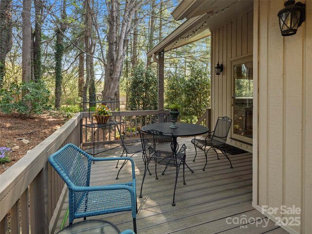 wooden deck with outdoor dining space