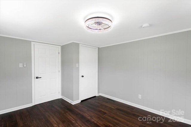 interior space featuring baseboards, a closet, and dark wood finished floors