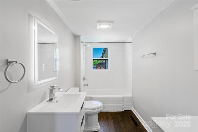 full bathroom featuring wood finished floors, vanity, bathtub / shower combination, toilet, and visible vents