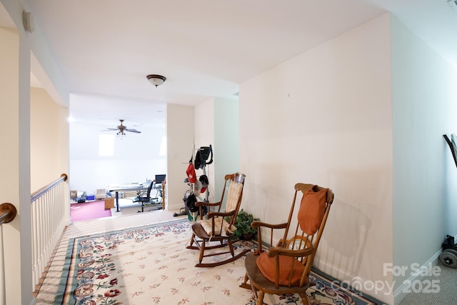 sitting room with ceiling fan