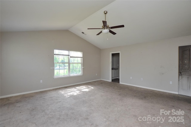 spare room featuring carpet flooring, visible vents, ceiling fan, baseboards, and vaulted ceiling