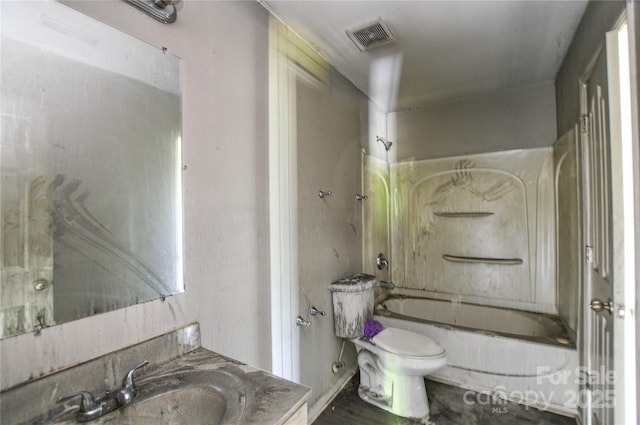 bathroom featuring toilet, visible vents, vanity, and shower / bathing tub combination