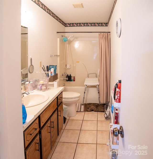 bathroom with vanity, visible vents, toilet, tile patterned floors, and shower / bath combo