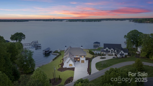 aerial view at dusk with a water view