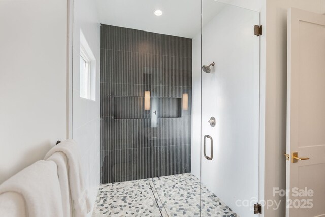 full bathroom featuring recessed lighting, tile patterned floors, and a shower stall