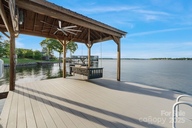 dock area with a gazebo and a water view
