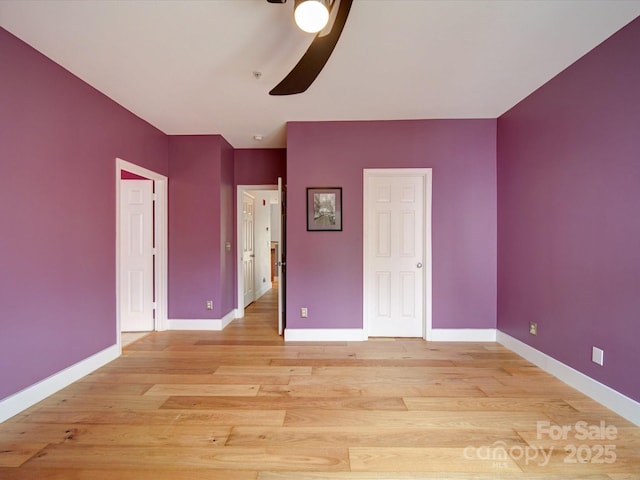 650 Raphael Pl, Charlotte, NC 28205 - unfurnished bedroom with baseboards, light wood-style floors, and ceiling fan