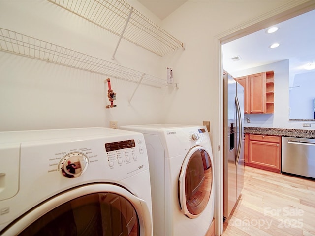 650 Raphael Pl, Charlotte, NC 28205 - washroom featuring separate washer and dryer, recessed lighting, and light wood-style flooring