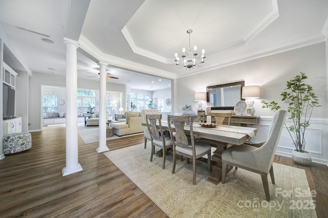 7123 Meyer Rd, Fort Mill, SC 29715 - dining room with crown molding, ceiling fan with notable chandelier, dark wood-style floors, and decorative columns