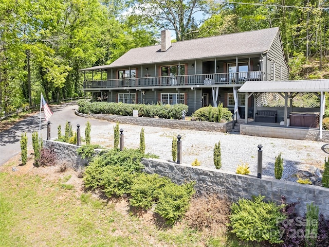 62 Cosmic Ln, Waynesville, NC 28786 - rear view of property with a hot tub, a chimney, and roof with shingles