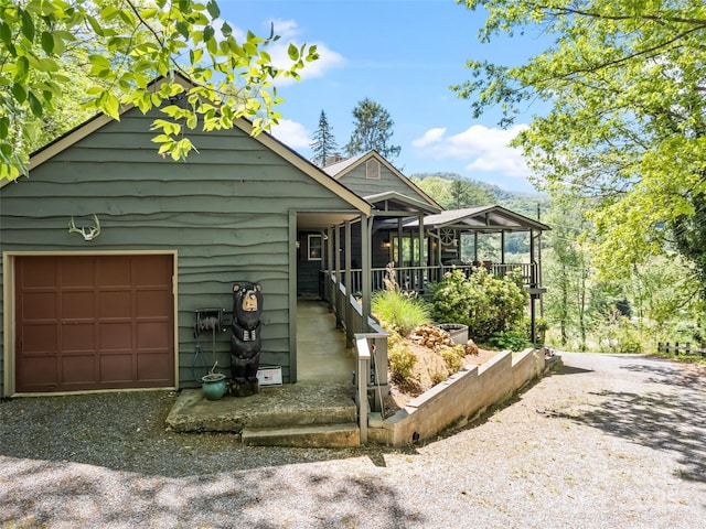 62 Cosmic Ln, Waynesville, NC 28786 - view of front of property with driveway and a sunroom