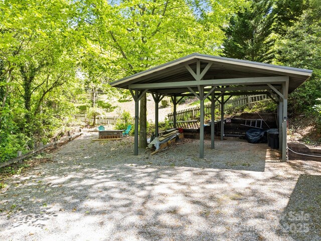 62 Cosmic Ln, Waynesville, NC 28786 - view of parking with fence and a detached carport