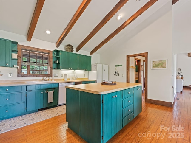 62 Cosmic Ln, Waynesville, NC 28786 - kitchen with open shelves, white dishwasher, beam ceiling, a kitchen island, and a sink