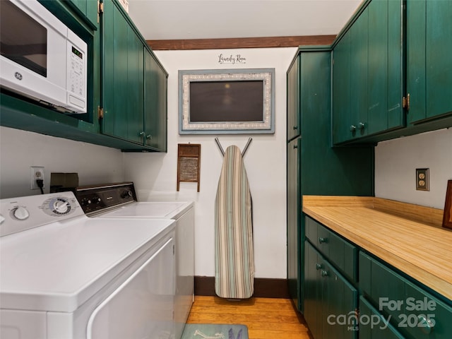 62 Cosmic Ln, Waynesville, NC 28786 - laundry room featuring cabinet space, separate washer and dryer, and light wood-style floors
