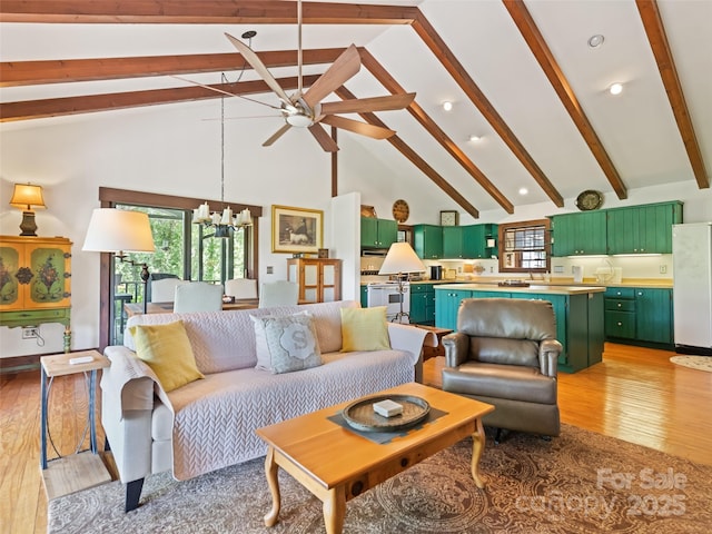 62 Cosmic Ln, Waynesville, NC 28786 - living area featuring high vaulted ceiling, beamed ceiling, light wood-style floors, a ceiling fan, and a chandelier