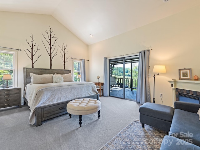 62 Cosmic Ln, Waynesville, NC 28786 - carpeted bedroom featuring access to outside, multiple windows, high vaulted ceiling, and a fireplace