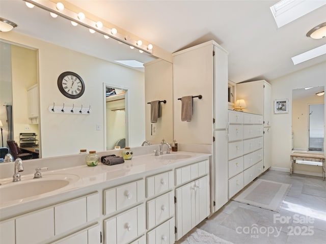 62 Cosmic Ln, Waynesville, NC 28786 - full bath featuring lofted ceiling, a skylight, and double vanity
