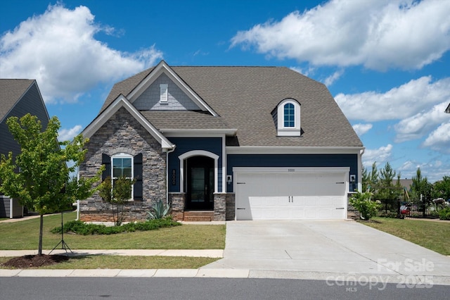 8000 Millbridge Pkwy, Waxhaw, NC 28173 - craftsman-style house featuring stone siding, concrete driveway, and a garage