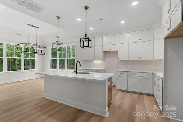 925 Twin Lakes Rd, Rock Hill, SC 29732 - kitchen with a sink, light wood-style flooring, backsplash, recessed lighting, and white cabinets