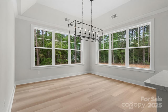 925 Twin Lakes Rd, Rock Hill, SC 29732 - unfurnished dining area featuring a chandelier, healthy amount of natural light, wood finished floors, and baseboards