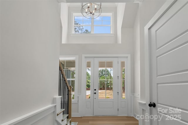 925 Twin Lakes Rd, Rock Hill, SC 29732 - entryway featuring a chandelier, stairway, wood finished floors, and a towering ceiling