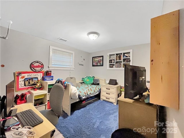 bedroom with visible vents and carpet floors