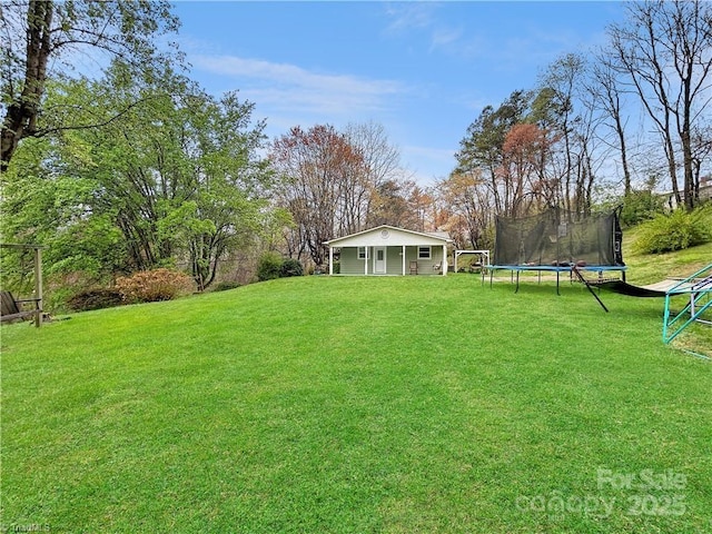 view of yard with a trampoline