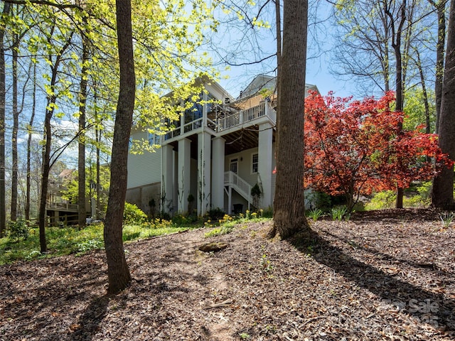 exterior space with stairs and a deck