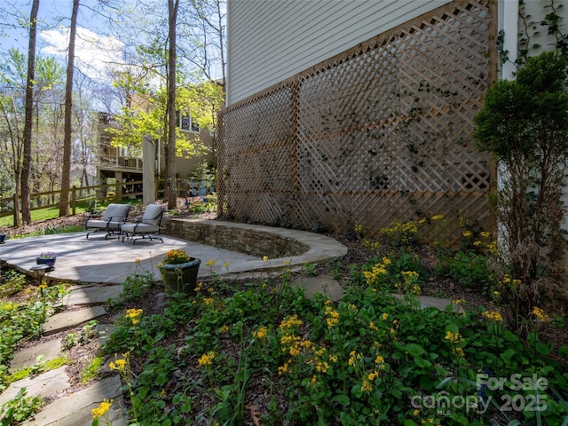 view of yard with fence and a patio area