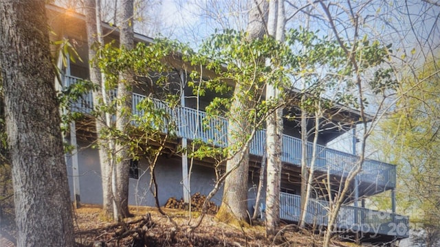 view of side of home with stucco siding